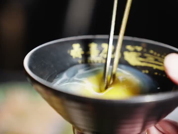 Wagyu dipped in a bowl of beaten egg